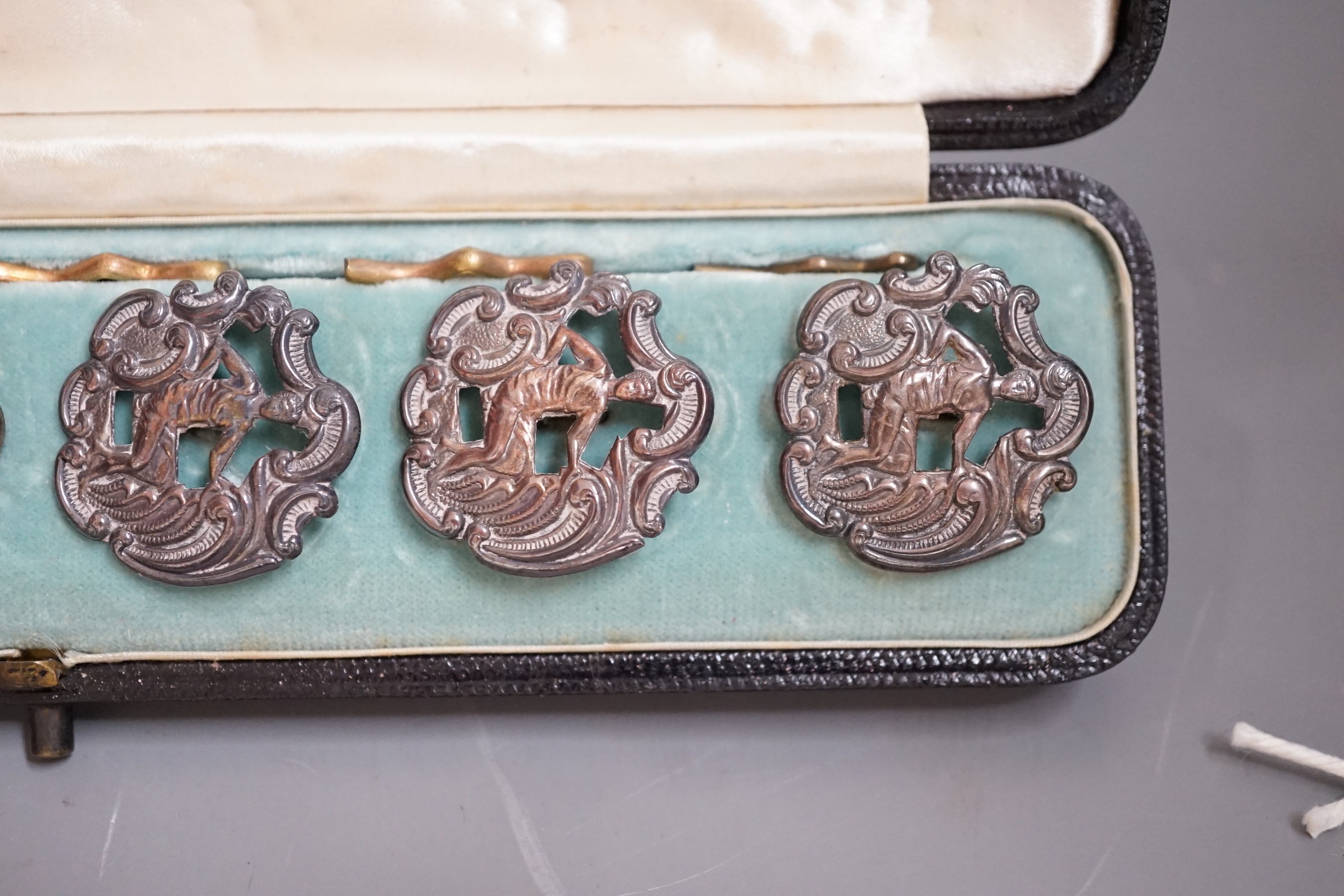 A cased set six late Victorian pierced silver dress buttons, depicting a gentleman wearing a toga, Levi & Salaman, Birmingham, 1899, 25mm.